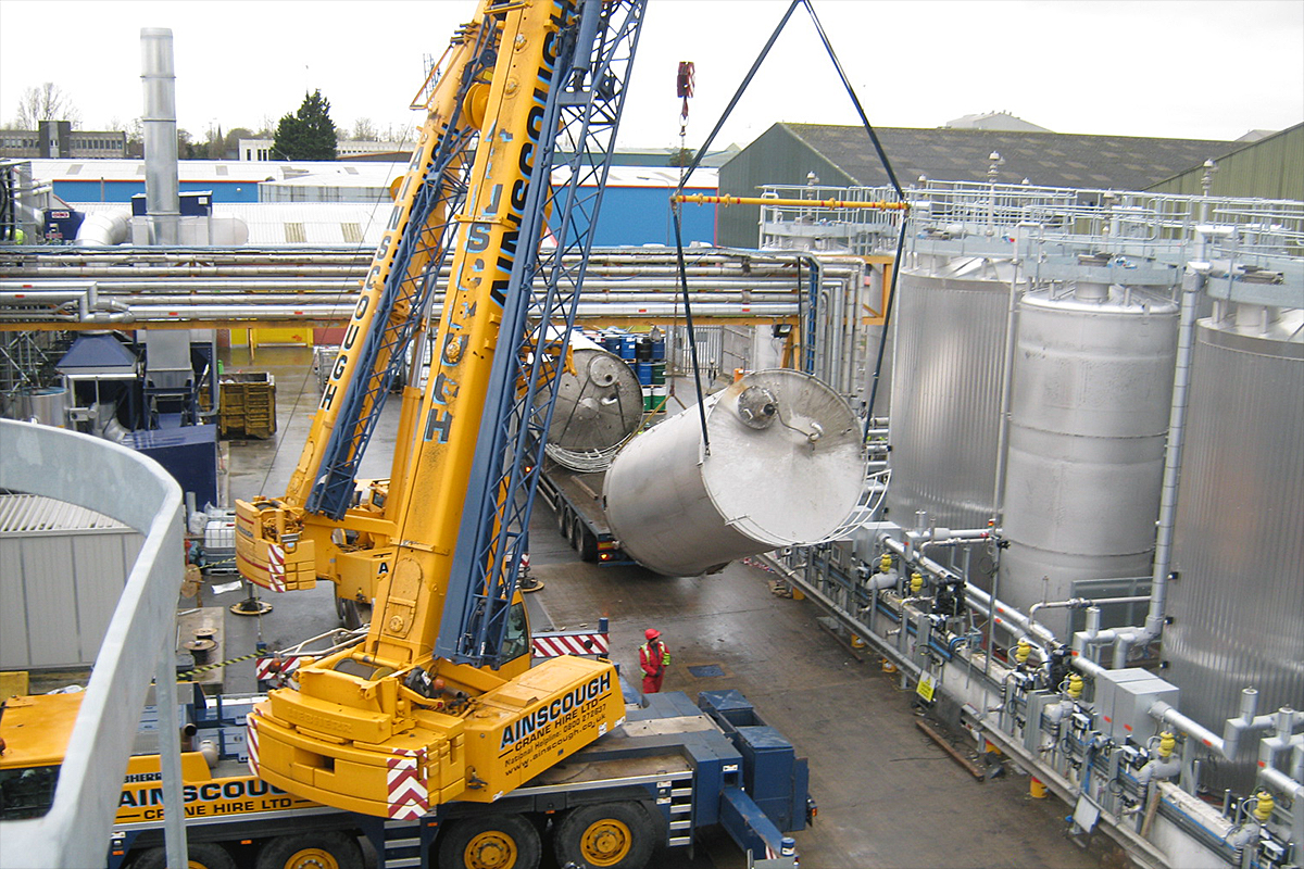 Raw material bulk storage vessel installation during manufacturing facility construction project