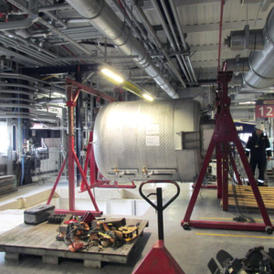 Mixer lifted onto wheeled trestles ready to be lowered into position.