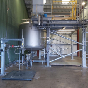 10,000-litre blending vessel installed with all associated infrastructure. To the left is an IBC weight scale